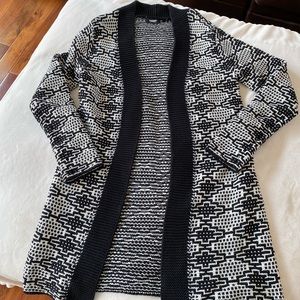Woman's black and white long tunic sweater